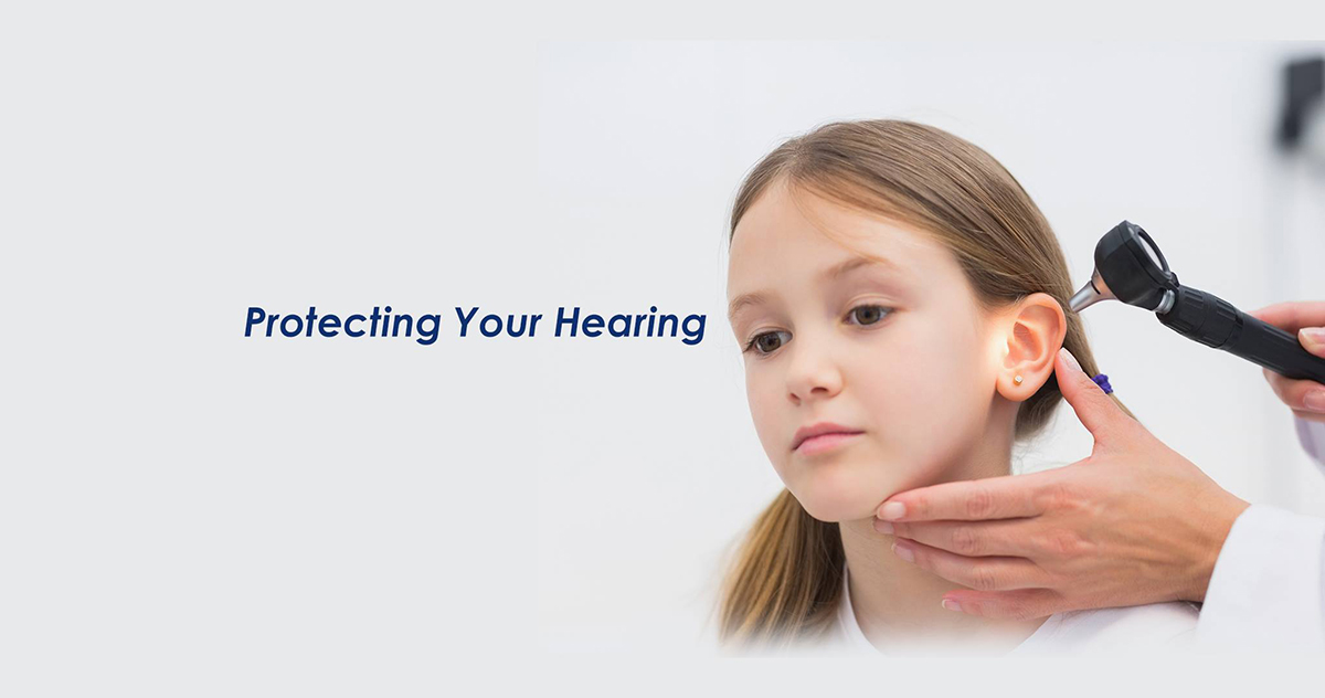Doctor examining child's ear to protect hearing health.